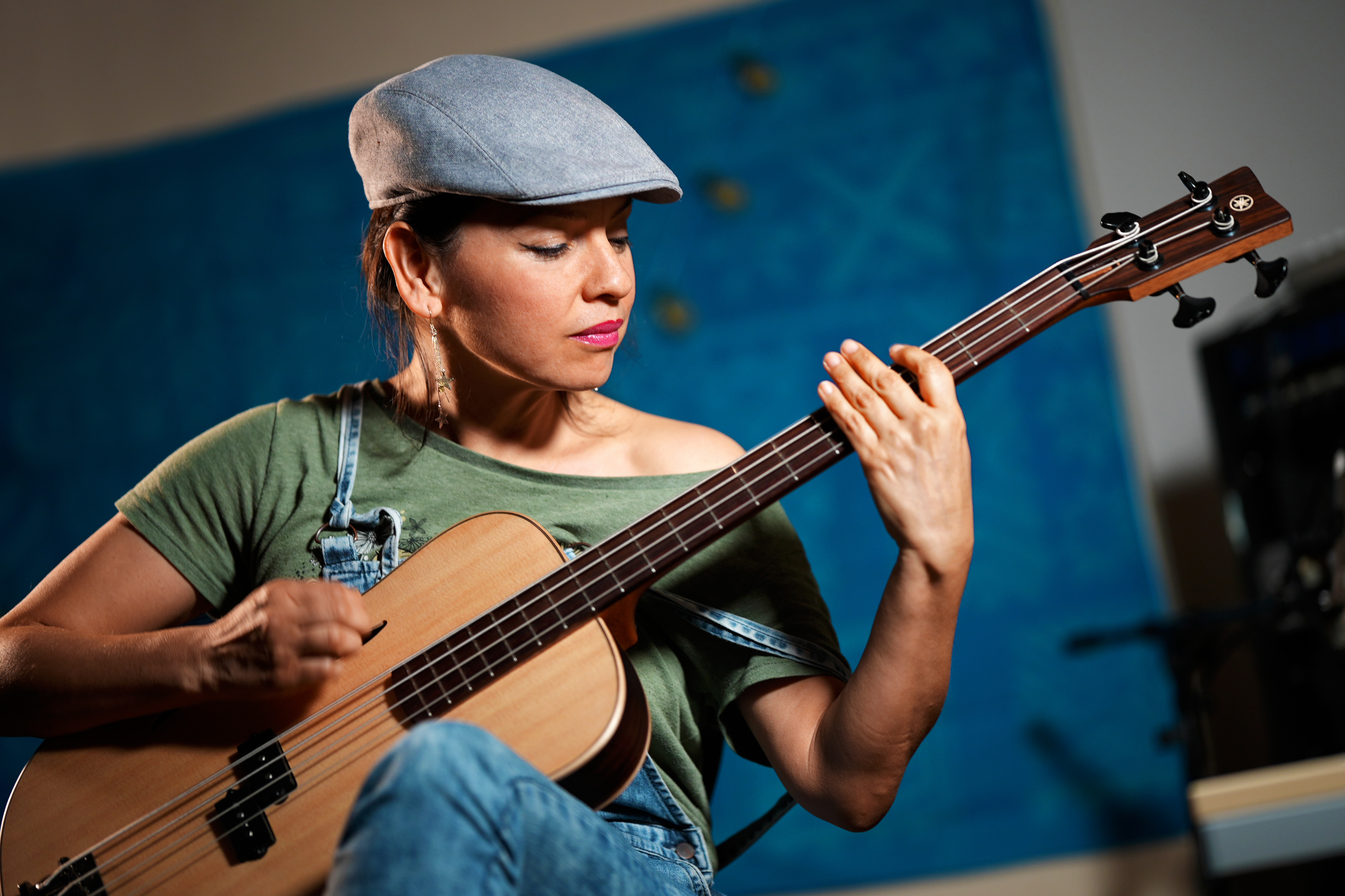 Gabriela Quintero playing guitar in the studio